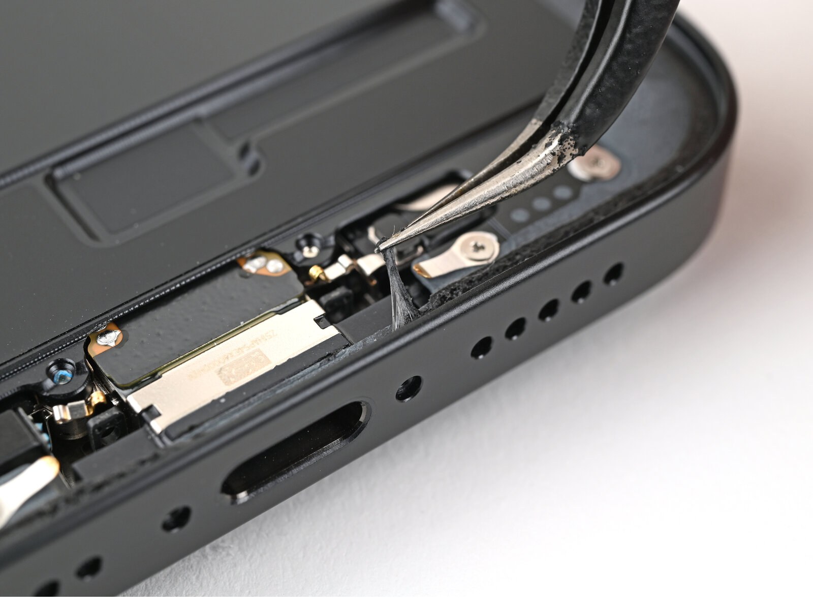 iPhone 16e — Remove the old adhesive (logo-free)